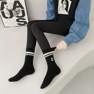 Thickened black winter mid-tube socks with stripes and C letter, warm and trendy athletic style.