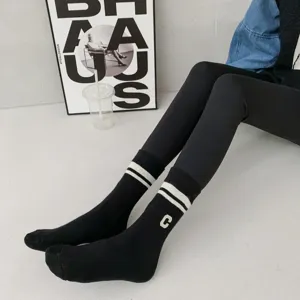 Thickened black mid-tube winter socks with white stripes and letter C embroidery detail.