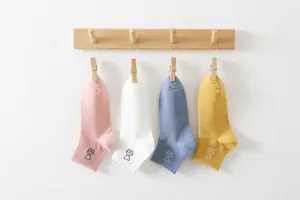 Cute Korean style women's solid color short socks with sweet rabbit embroidery detail.
