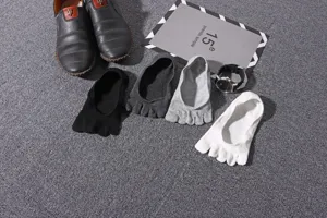 Detail view of men's five toe socks in various colors, breathable cotton boat socks for summer daily wear.