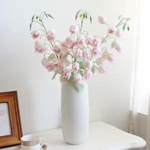 Artificial pink bell flower bouquet in white ceramic vase for home wedding decoration