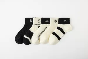 Detailed close-up shot of breathable mesh summer short socks in classic black & white colors.