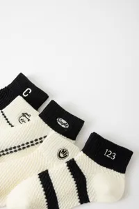 Breathable mesh women short socks with cute embroidery letters and stripes, comfortable daily wear.
