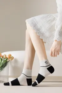 Comfortable breathable mesh short socks for women, stylish black and white contrast design.