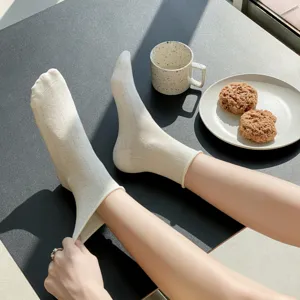 Detail shot of women's summer breathable hollow out casual mid tube cotton socks.