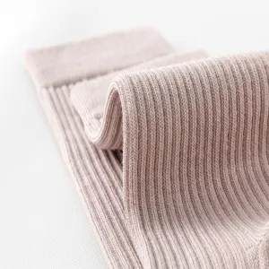 Close-up detail shot of soft ribbed knit fabric texture, fine knitting design for apparel.