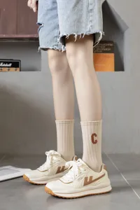 Korean solid color retro mid-tube socks for women, autumn winter casual socks detail.