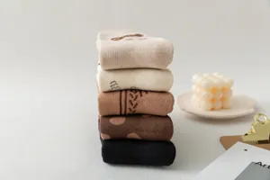 Comfortable thick cotton mid-tube socks in versatile neutral earth tones for women daily wear.