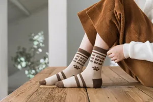 Thickened cotton mid-tube socks for women, featuring cute bear and paw knit details.