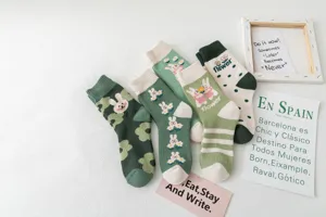 Cute rabbit and flower pattern winter cotton looped socks detail shot, cozy warm crew socks.