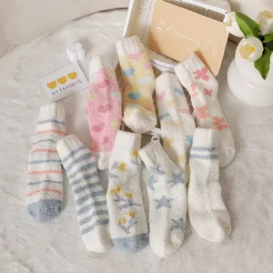 Cozy fuzzy plush mid-calf warm socks for women with cute hearts and stripes patterns
