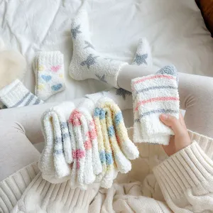Women cozy fuzzy coral fleece mid-calf socks with cute star and heart patterns for home
