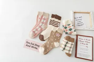 Detailed view of cozy autumn and winter casual cotton terry socks in various cute patterns.