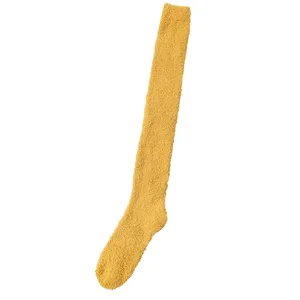 Cozy yellow fuzzy over-the-knee socks, thick coral fleece warm winter sleep stockings for women.
