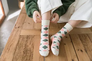 Detailed view of women winter argyle pattern loop socks, cozy thick thermal cotton.