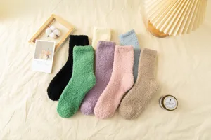 Close-up of cozy solid color coral fleece mid-tube socks in various soft autumn winter colors.