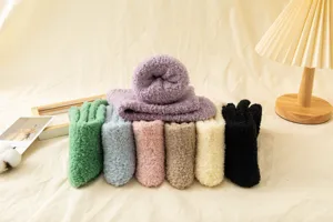 Close-up detail of soft fuzzy coral fleece socks displayed in multiple vibrant cozy colors.
