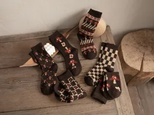 Detailed shot of retro brown knit wool socks with cute mushroom and checkerboard patterns.