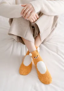 Cute bear fleece warm socks for women winter thick cozy fluffy floor socks detail shot.