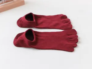 Detail view of women's maroon shallow five-toe socks, showing soft fabric detail.