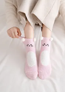 Cute cat fuzzy coral fleece warm winter socks for women with lovely pom-pom details.
