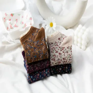 Detailed view of vintage floral lace boat socks, soft cotton material, cute Japanese style.