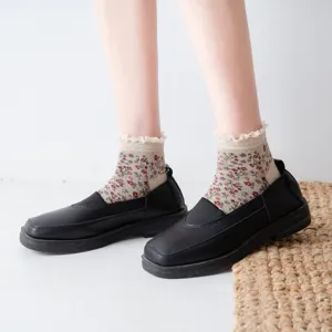 Detail view of Japanese retro floral print short socks with delicate lace trim worn on feet.