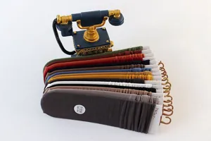 Detailed view of women stackable long socks in various solid colors with hanging cardboard tags.