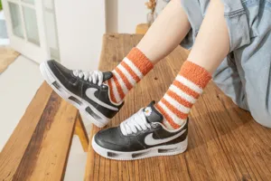 Cozy coral fleece striped socks detail shot, soft warm thick winter tube socks for women.