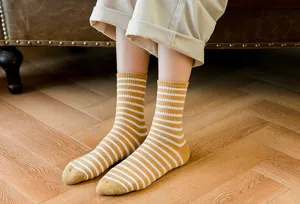 Striped cotton socks detail, soft fabric, cozy yellow white stripes daily wear design.