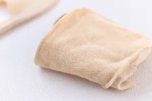 Close-up detail of nude ice silk forefoot pad and invisible liner sock texture design