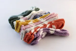 Cozy fuzzy coral fleece winter socks with cute soft texture and warm home floor design.