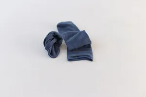 Detailed shot of solid blue grey women socks, lightweight rolled cuff design, comfortable wear.