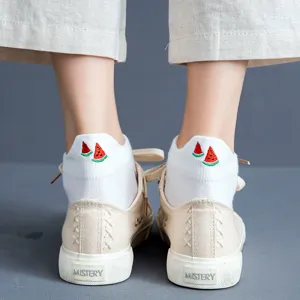 cute white short socks for women with watermelon embroidery paired with beige canvas shoes