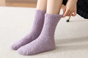 Detail shot of cozy purple coral fleece mid-calf socks showcasing soft plush texture for winter warmth.