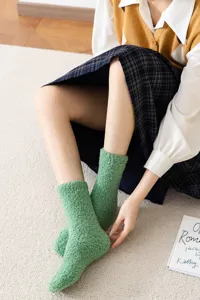 Cozy green fluffy coral fleece socks for women, soft winter warm mid tube casual wear.