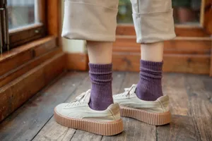Thickened fleece-lined winter solid color mid-tube slouch socks for women, cozy and warm.