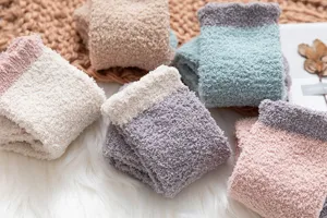 Fluffy coral fleece fuzzy sleep socks detail, cozy warm winter plush home socks display.