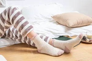 Thick coral fleece sleep socks for women, cozy winter warm fuzzy mid-tube socks for home.