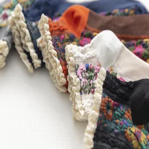 Japanese vintage floral embroidered women's socks with delicate lace ruffle cuffs detail.