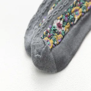 Grey floral embroidered socks featuring intricate knit patterns for women daily wear.