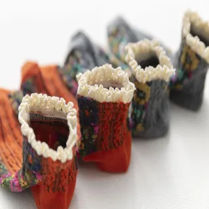 Detailed view of vintage floral ruffled ankle socks with delicate lace trim design.