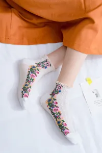 Detailed view of cute floral pattern socks with delicate lace trim. Perfect daily wear.