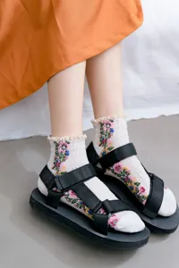 Japanese style floral lace ruffle short socks detail view showing exquisite embroidery.