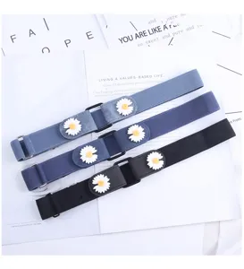Close up detail of women elastic lazy belt featuring cute white daisy floral decoration.