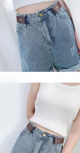 Invisible lazy belt and elastic waist clip paired with denim shorts for women fashion style.