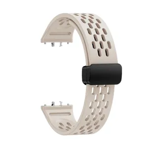 Silicone replacement watch band with breathable holes and magnetic folding clasp for smart watch.