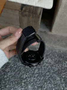 Black litchi grain leather magnetic folding buckle watch strap replacement accessory.