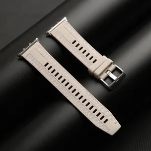 Detailed close-up of beige composite woven silicone watch strap with silver metal buckle.