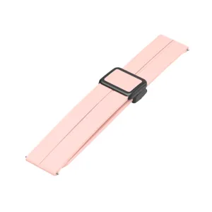 Pink silicone watch strap detail, featuring a black magnetic folding buckle, compatible smart watch.